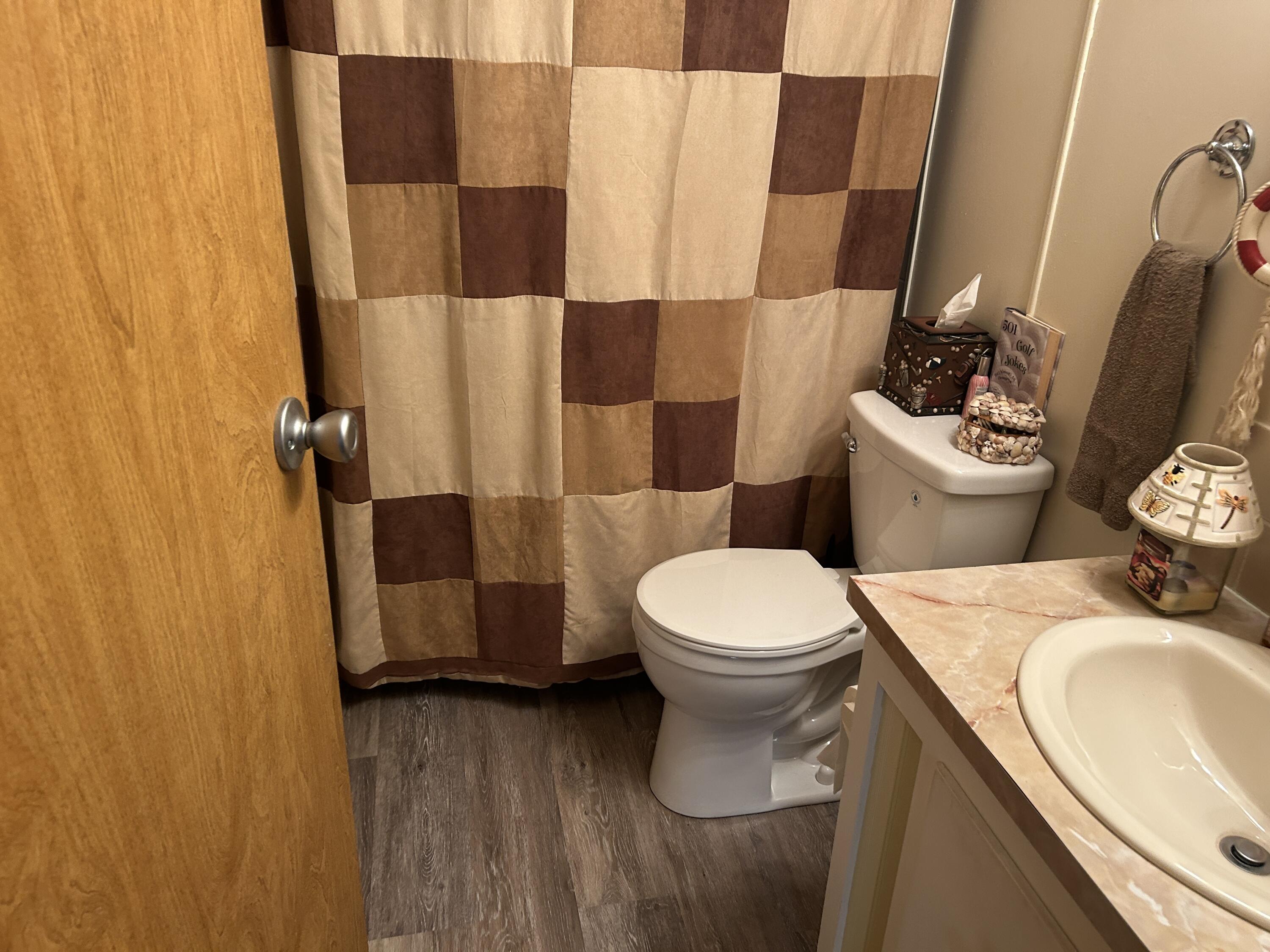 63 Ipanema Way Fort Pierce, FL 34951 - Photo 33 of 49 a bathroom with a sink and a toilet