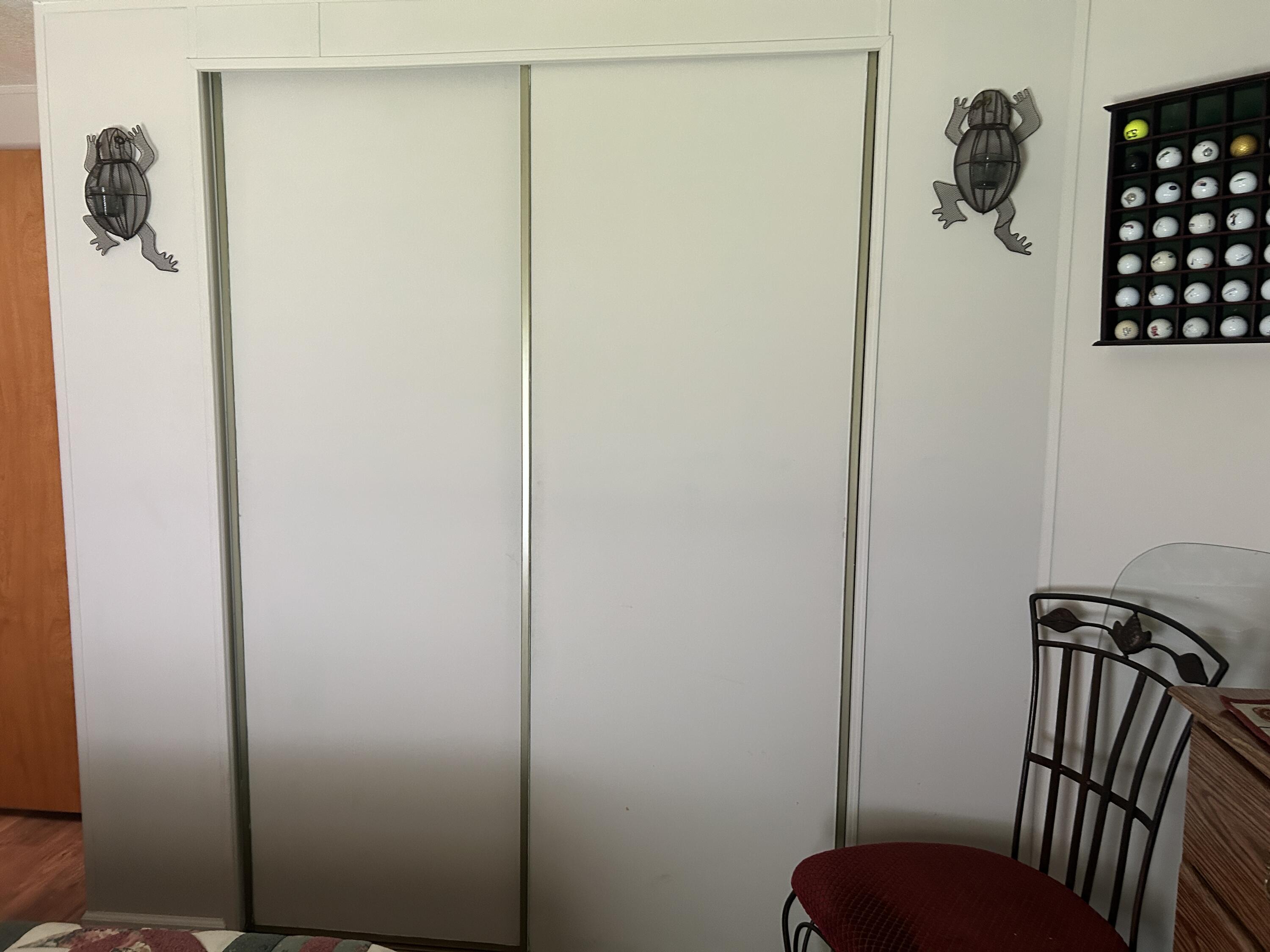 63 Ipanema Way Fort Pierce, FL 34951 - Photo 38 of 49 a view of a hallway with closet and wooden floor