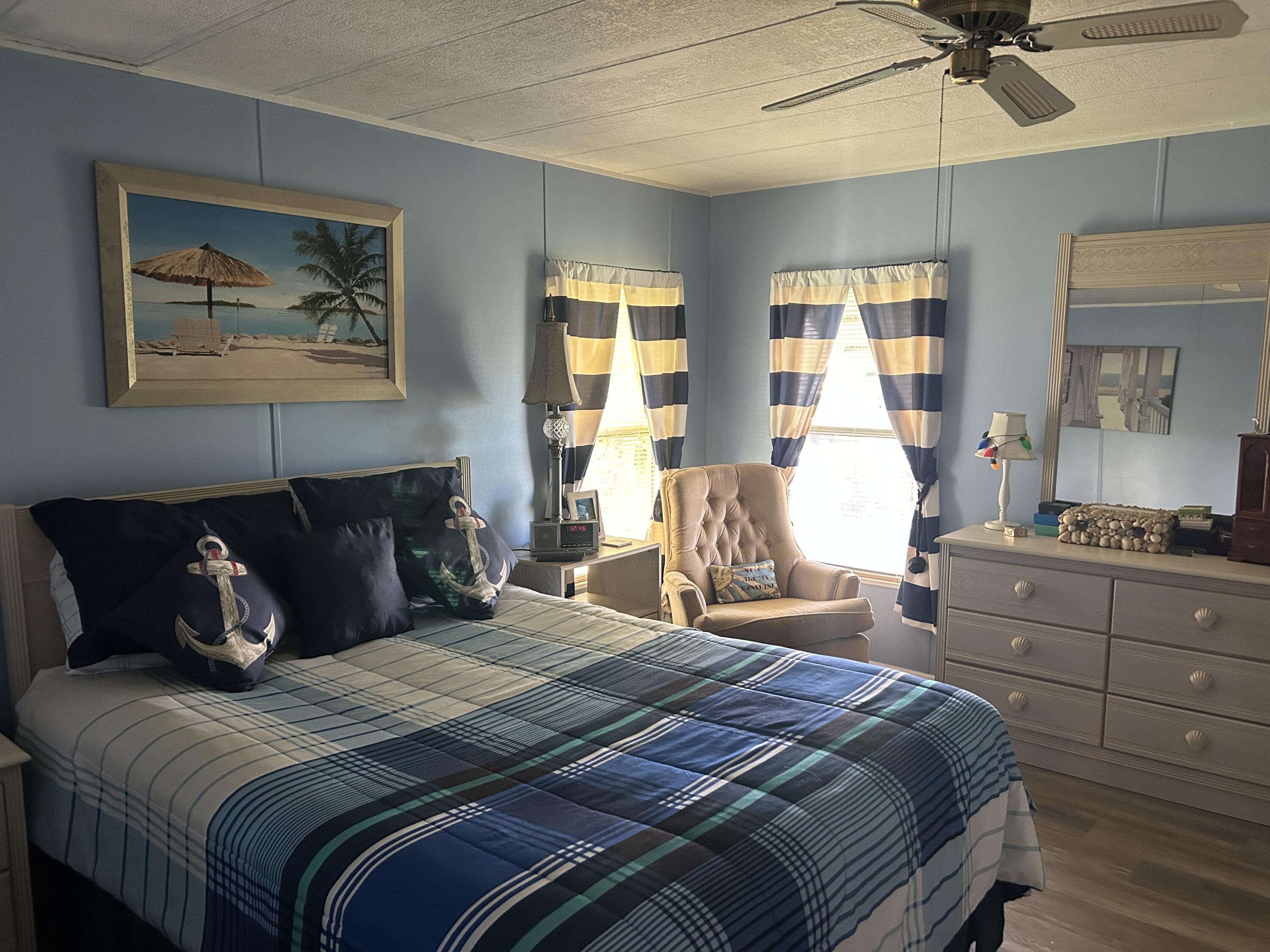 63 Ipanema Way Fort Pierce, FL 34951 - Photo 40 of 49 a bedroom with a bed and window