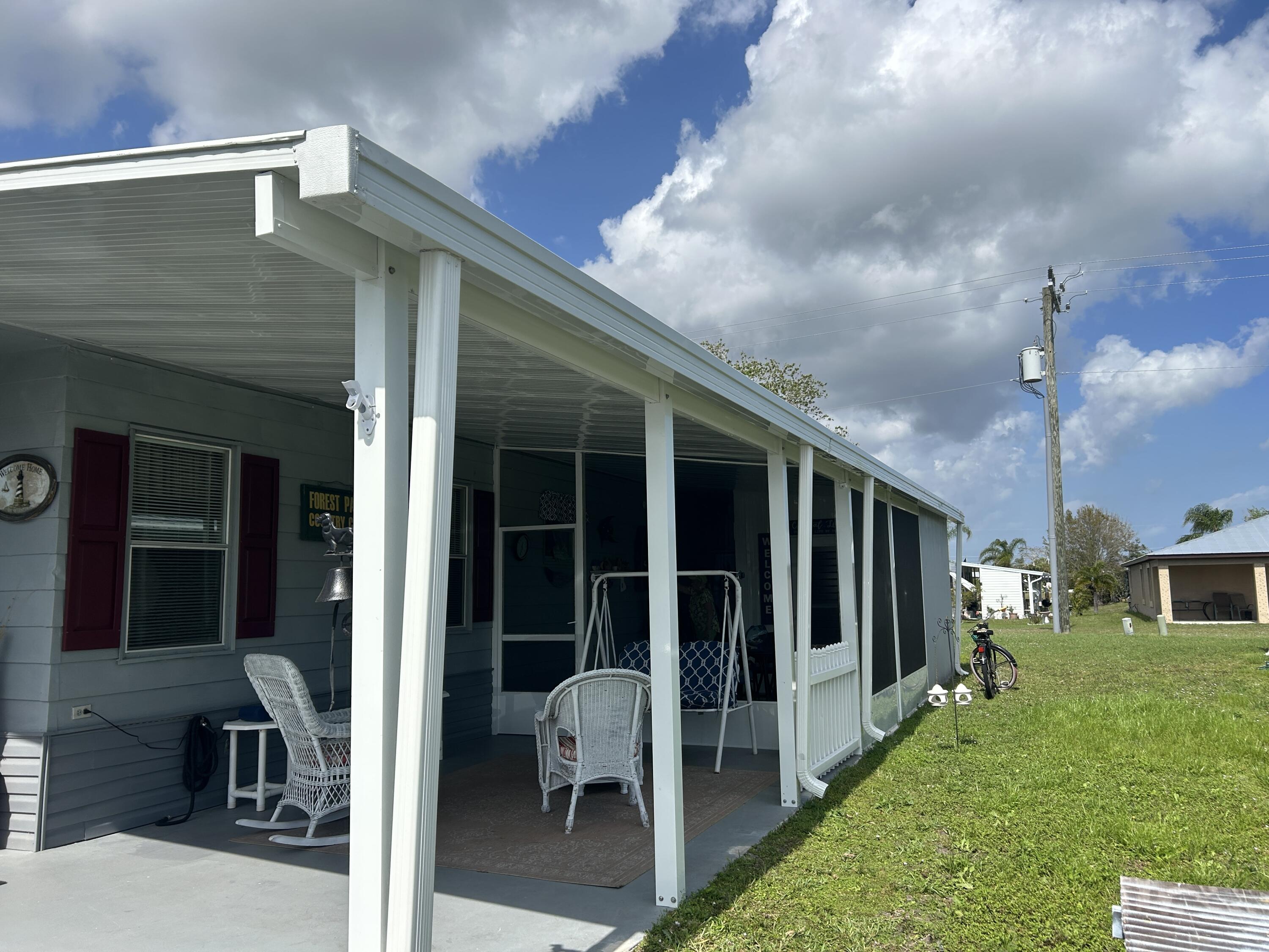 63 Ipanema Way Fort Pierce, FL 34951 - Photo 4 of 49 a view of a house with backyard and porch