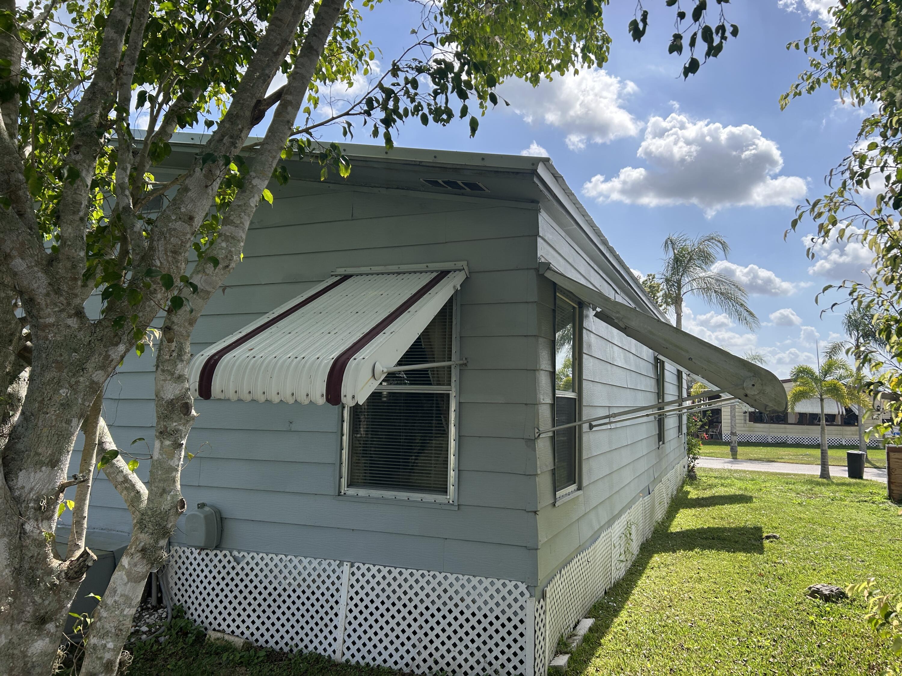 63 Ipanema Way Fort Pierce, FL 34951 - Photo 10 of 49 a view of house with a yard