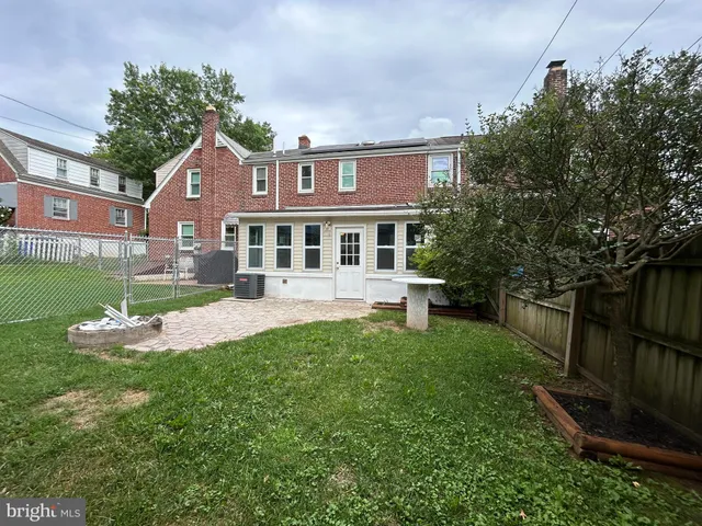 a view of a backyard with a small cabin