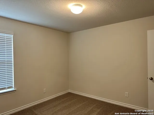 a view of a room that has a window