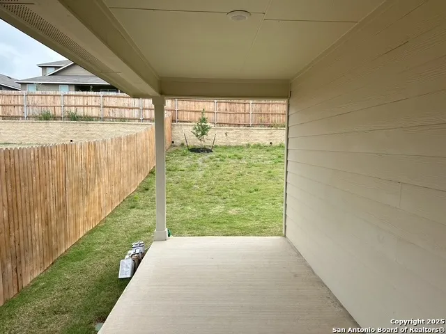 a view of a back yard from a patio