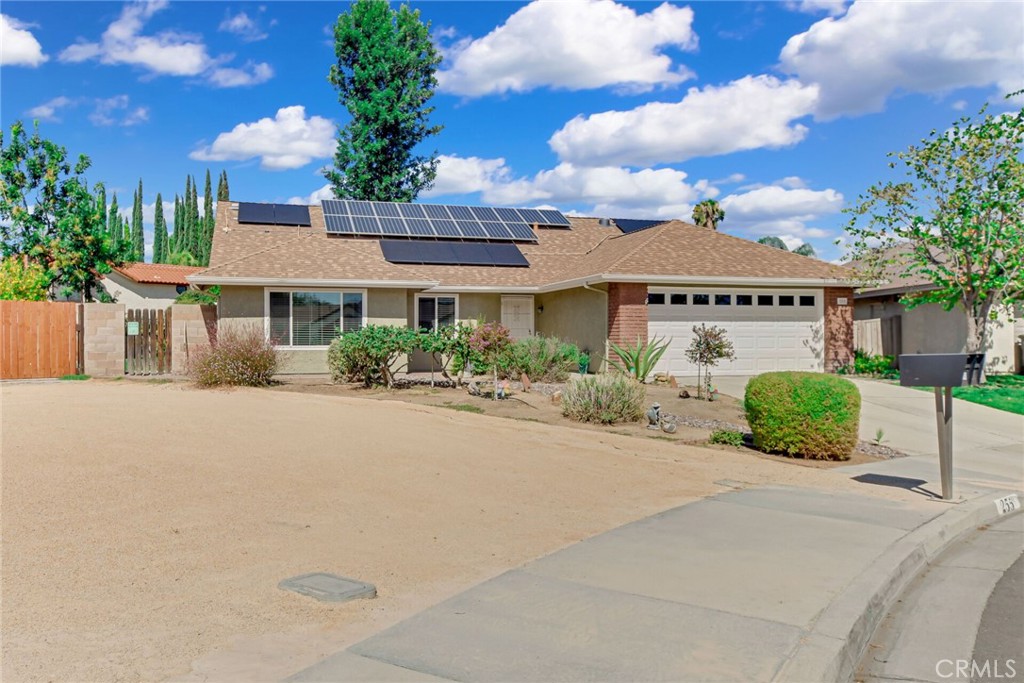 255 Mosport Street Hemet, CA 92544 - Photo 3 of 31 a front view of a house with garden