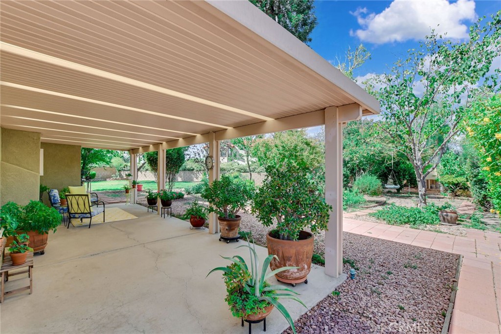 255 Mosport Street Hemet, CA 92544 - Photo 31 of 31 a view of a patio with furniture and garden