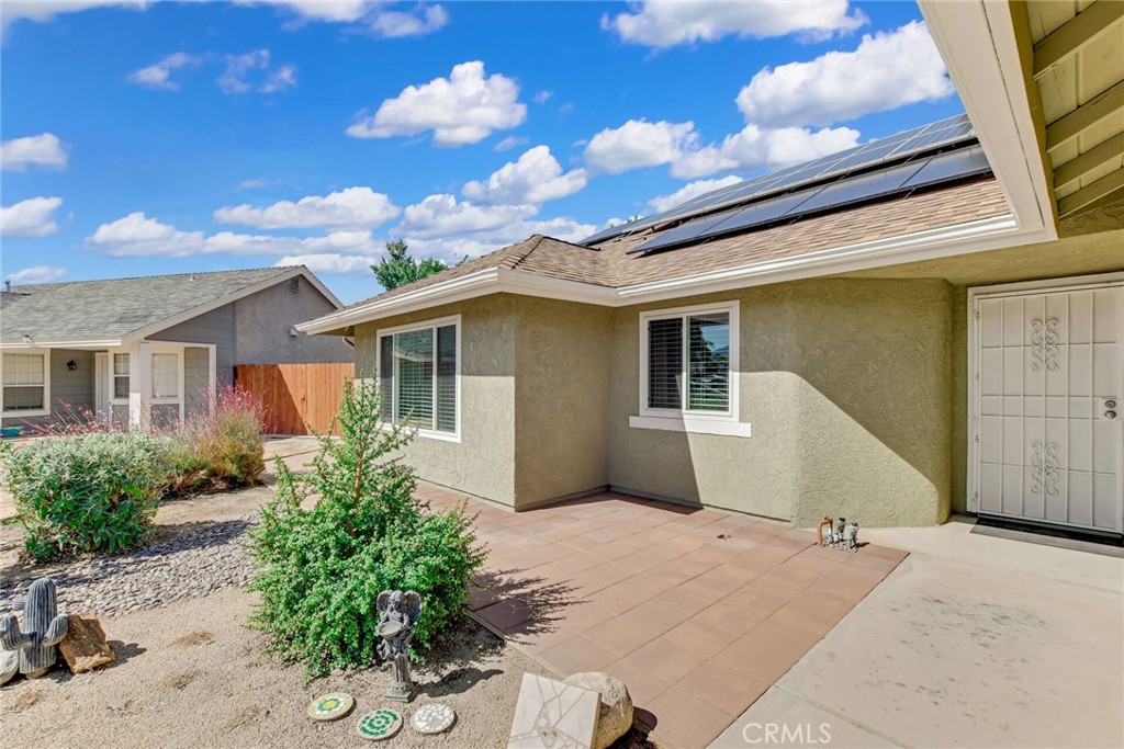 255 Mosport Street Hemet, CA 92544 - Photo 4 of 31 a front view of a house with a yard