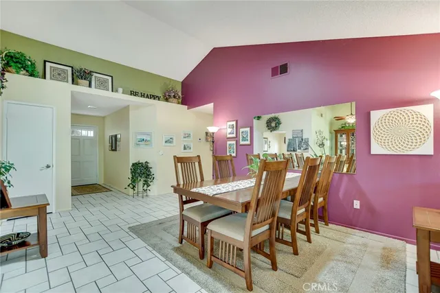 a dining room with furniture and a chandelier