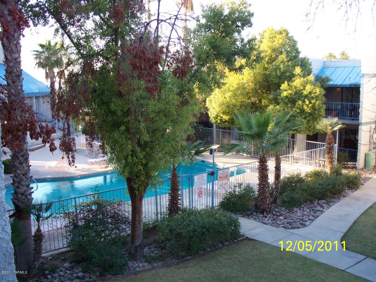7777 East Golf Links Road, Unit 2205 Tucson, AZ 85730 - Photo 15 of 22 a front view of a house with garden