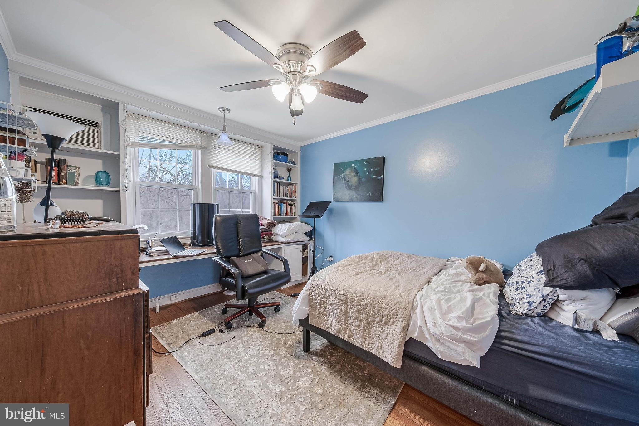 2018 Tunlaw Road Northwest Washington, DC 20007 - Photo 12 of 17 a bedroom with a bed and wooden floor