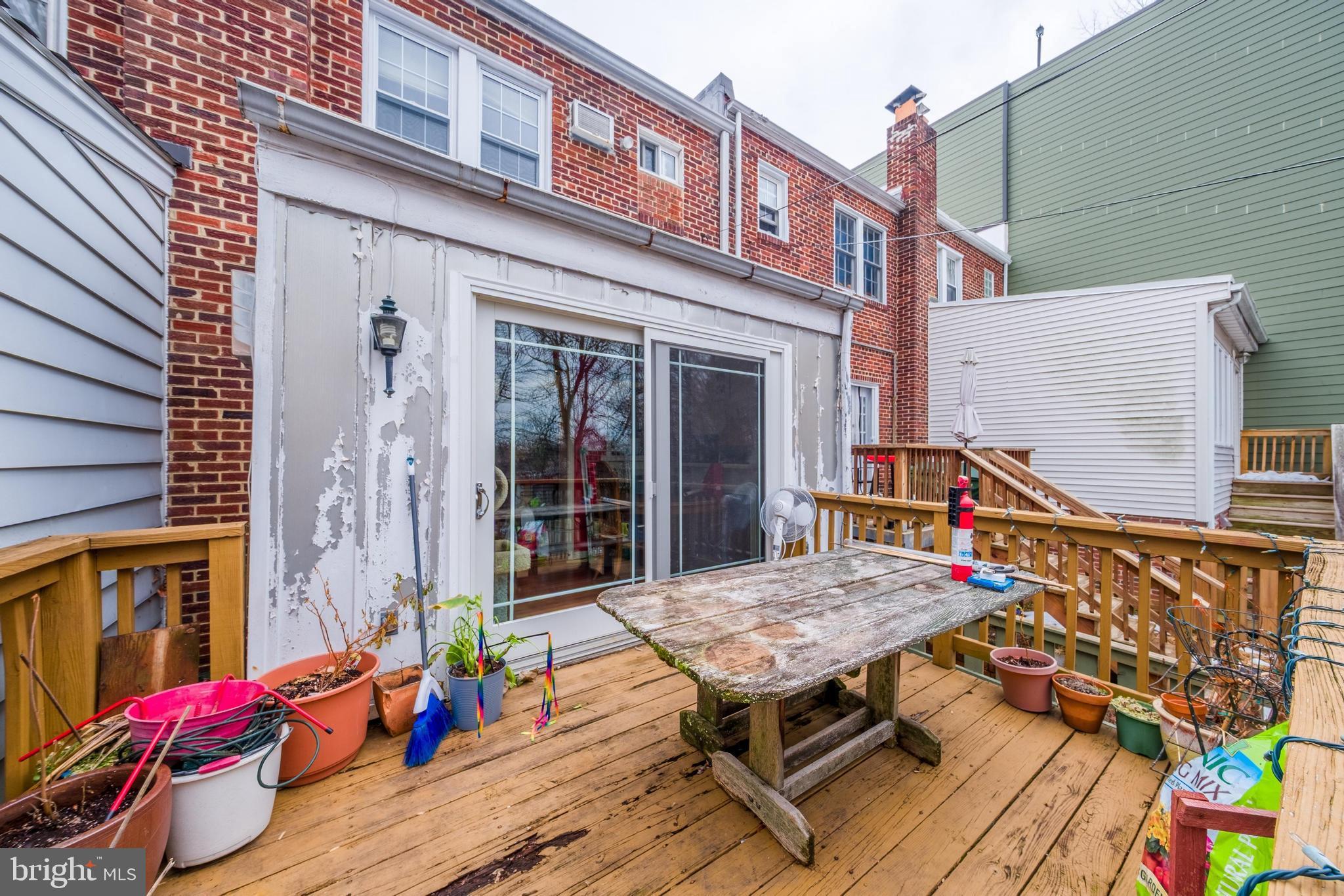 2018 Tunlaw Road Northwest Washington, DC 20007 - Photo 15 of 17 front view of a house with a table and chairs