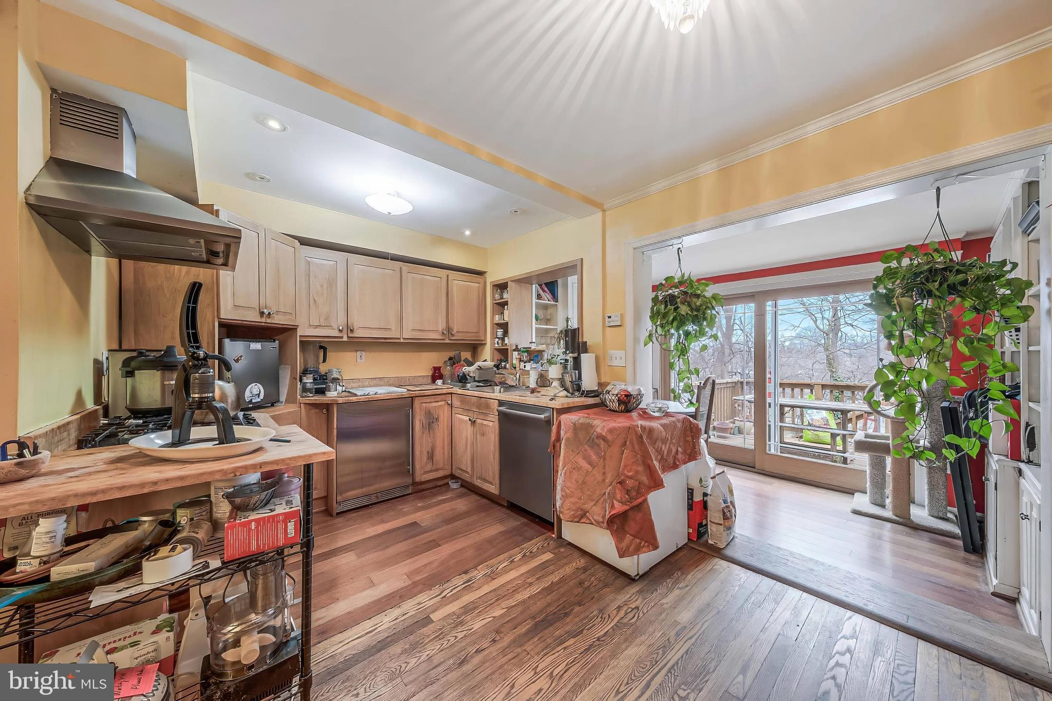2018 Tunlaw Road Northwest Washington, DC 20007 - Photo 5 of 17 a kitchen with a table chairs refrigerator and a window