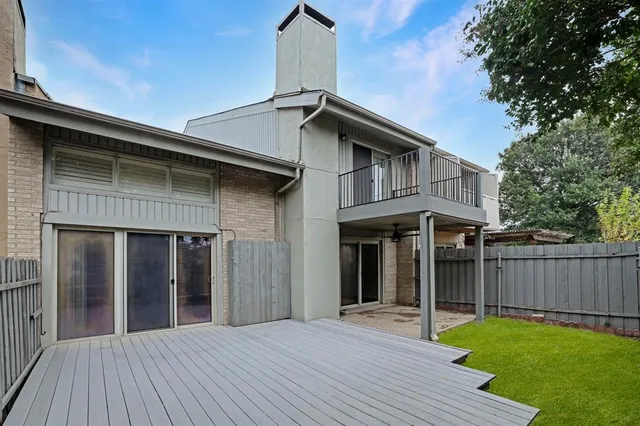 a view of a lake with houses in the back