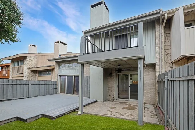a kitchen with stainless steel appliances kitchen island granite countertop a stove a sink and a refrigerator