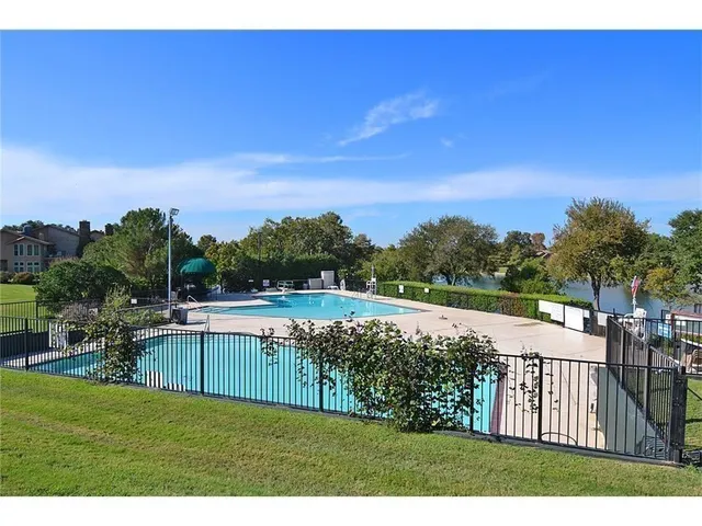 a view of house with backyard and deck