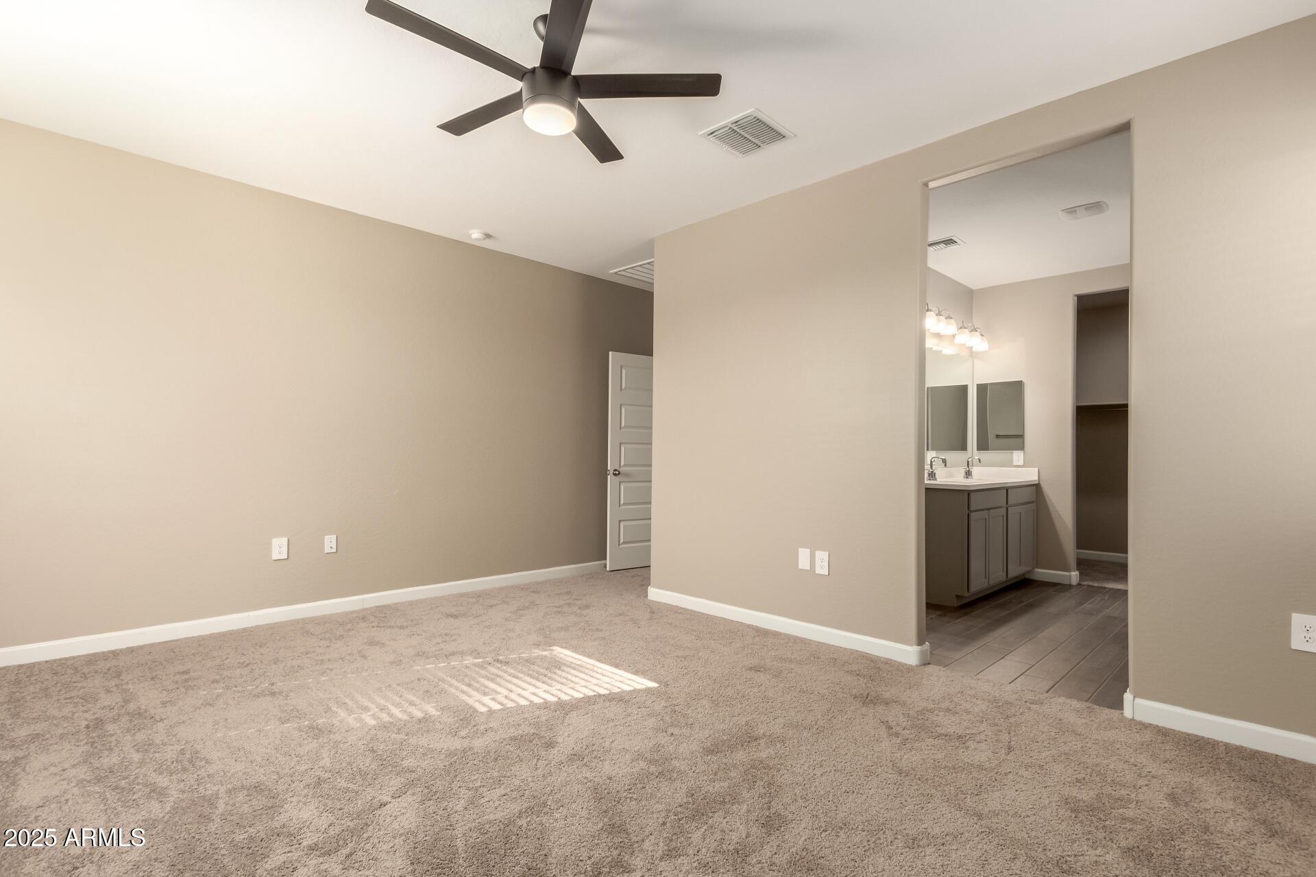 1357 East Chillingham Road San Tan Valley, AZ 85143 - Photo 16 of 32 a view of a room with a ceiling fan and entryway