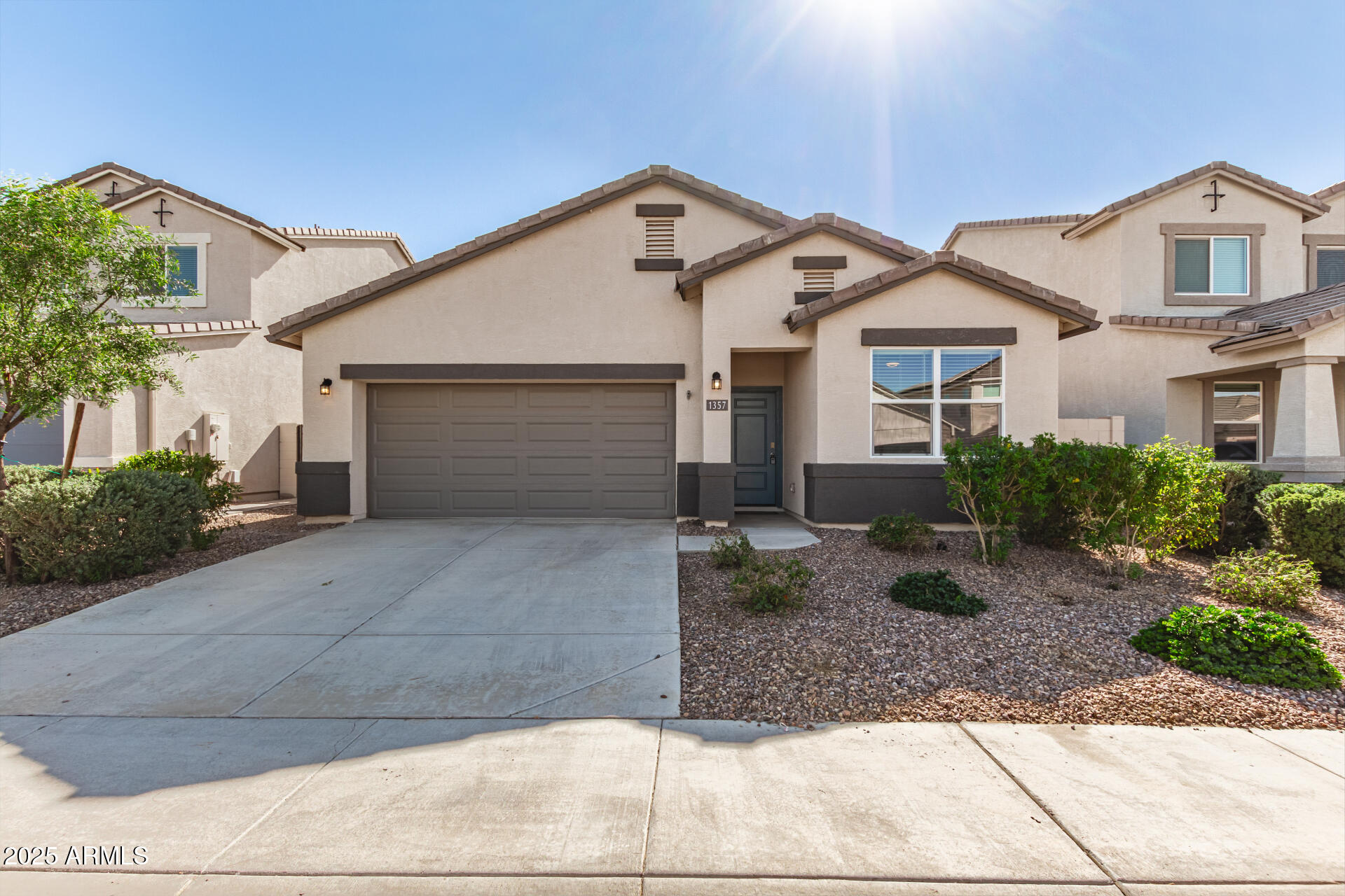 1357 East Chillingham Road San Tan Valley, AZ 85143 - Photo 2 of 32 a front view of a house with garden