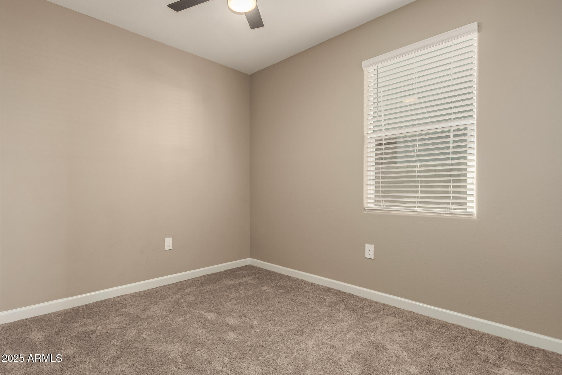 1357 East Chillingham Road San Tan Valley, AZ 85143 - Photo 23 of 32 an empty room with a window