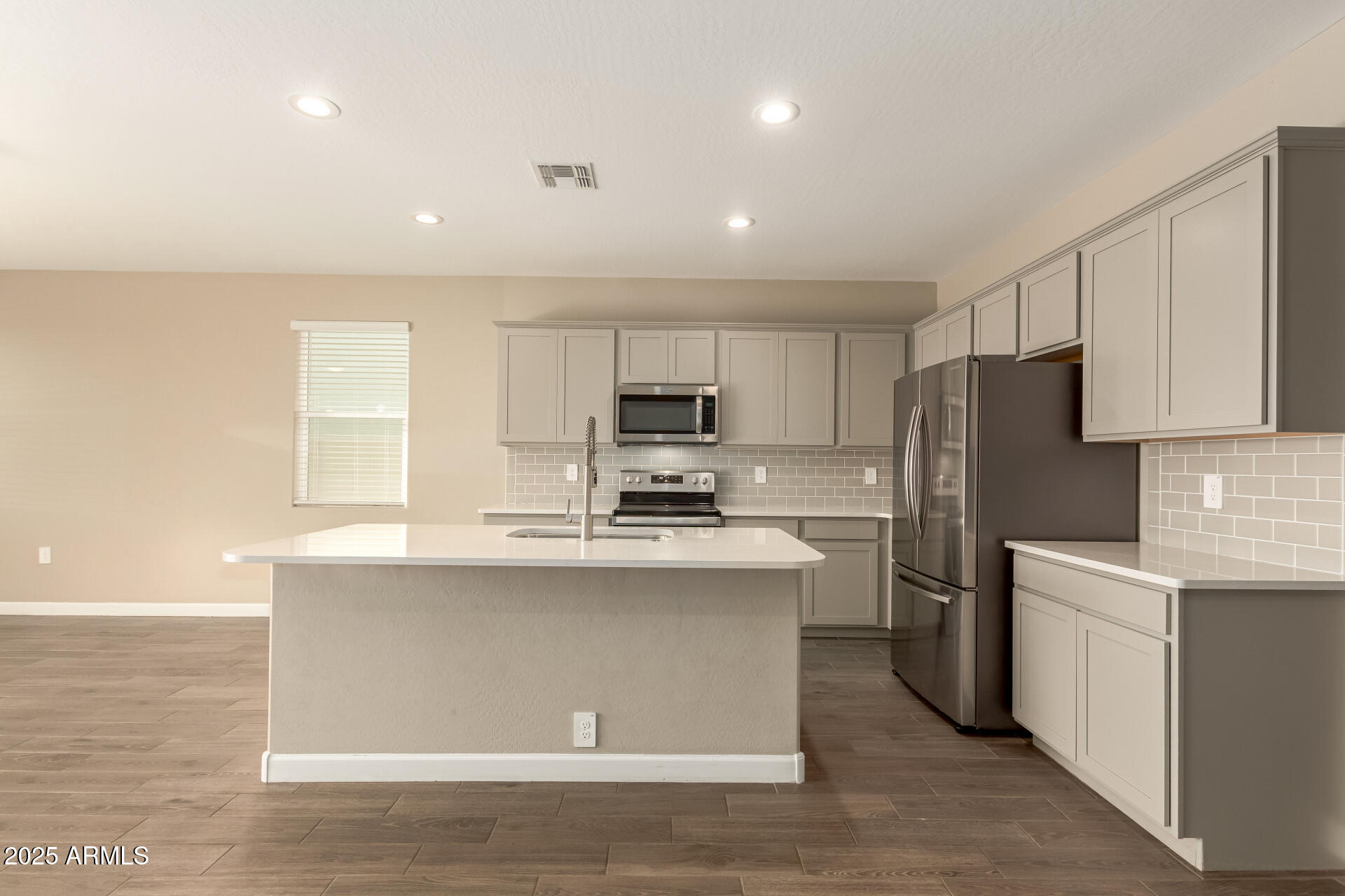 1357 East Chillingham Road San Tan Valley, AZ 85143 - Photo 10 of 32 a kitchen with stainless steel appliances granite countertop a sink stove and refrigerator