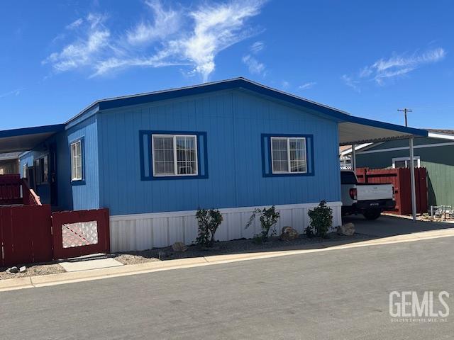 Undisclosed Address Tehachapi, CA 93561 - Photo 2 of 13 a backyard of a house with barbeque oven and outdoor seating