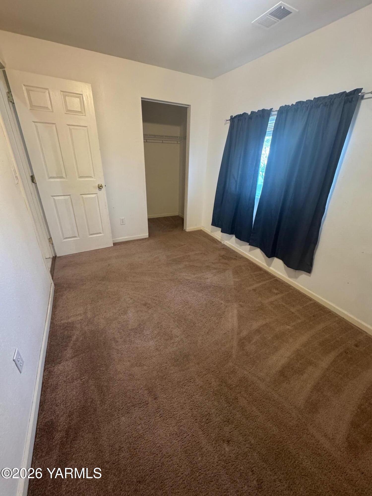 110 East Second Street Naches, WA 98937 - Photo 12 of 17 a view of an empty room with wooden floor