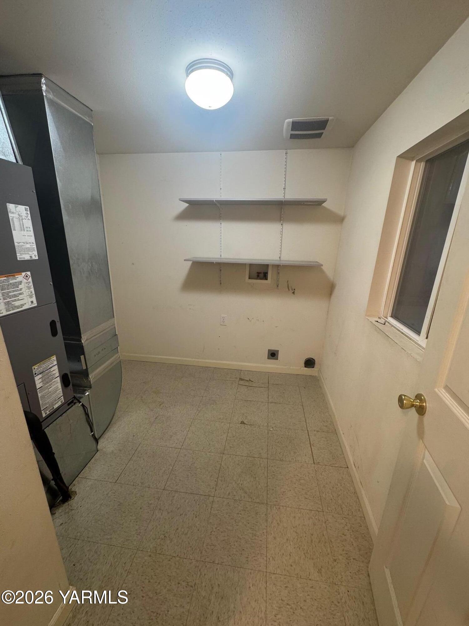 110 East Second Street Naches, WA 98937 - Photo 13 of 17 a view of storage and utility room with racks on the wall