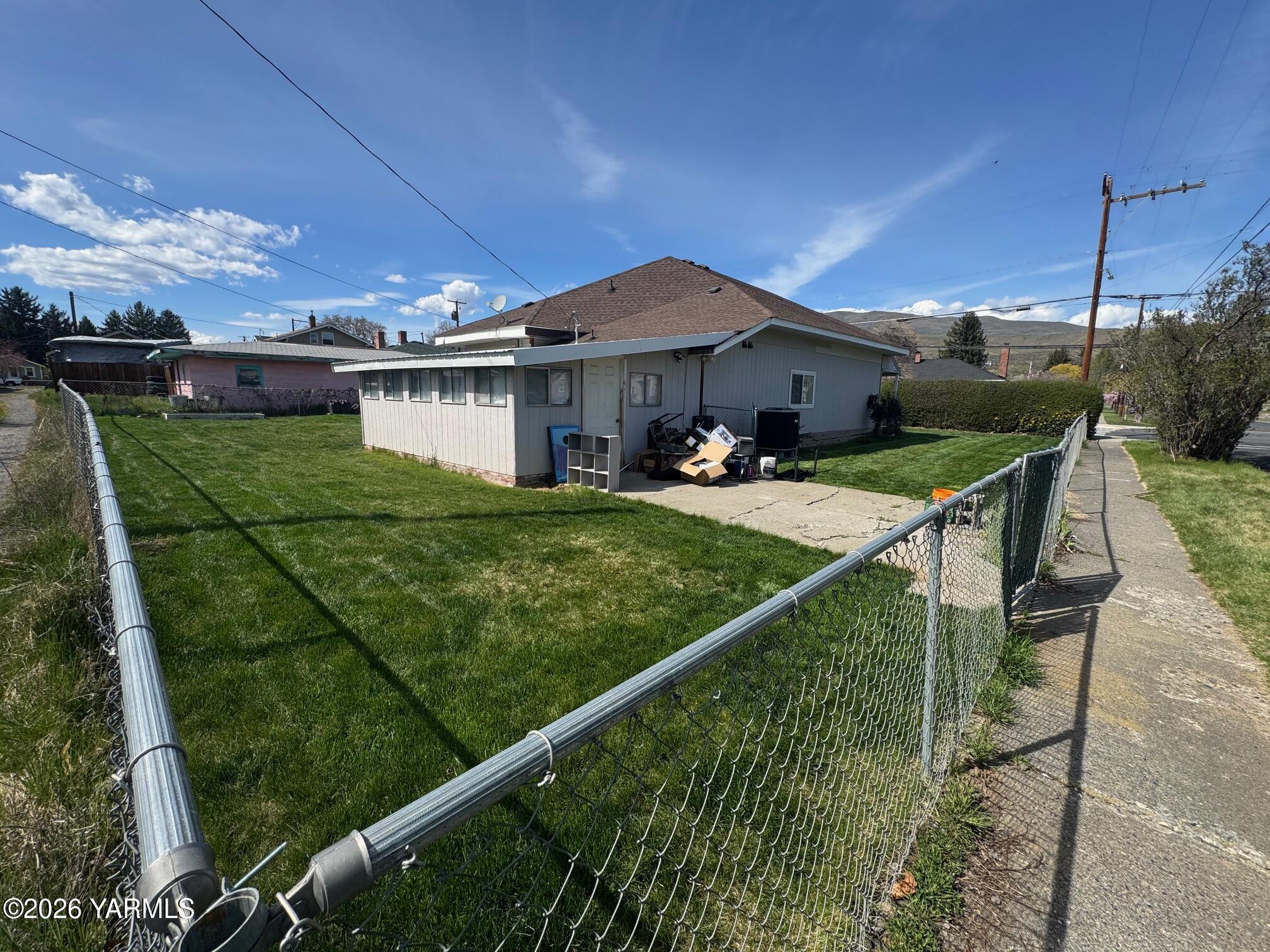 110 East Second Street Naches, WA 98937 - Photo 4 of 17 a view of a house with backyard and porch