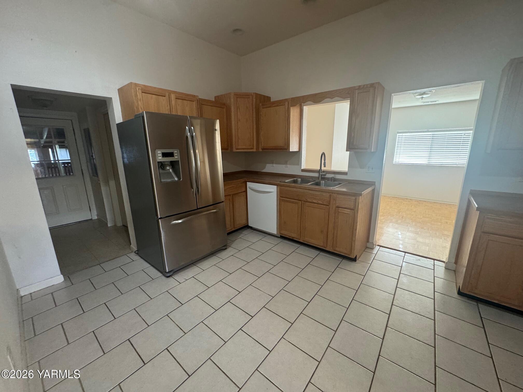 110 East Second Street Naches, WA 98937 - Photo 5 of 17 a kitchen with stainless steel appliances granite countertop a refrigerator and a sink