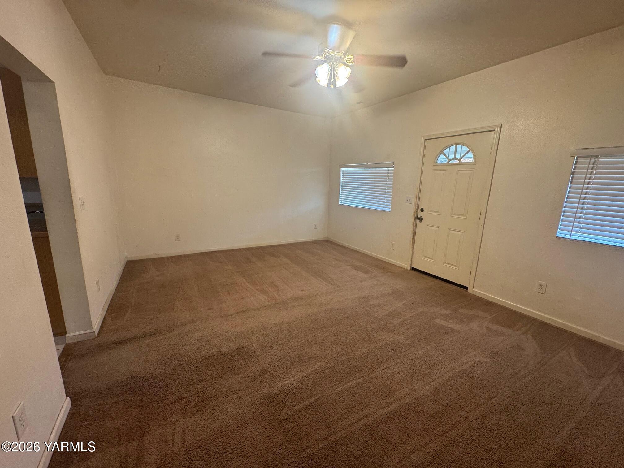 110 East Second Street Naches, WA 98937 - Photo 8 of 17 en empty room with windows and entrance