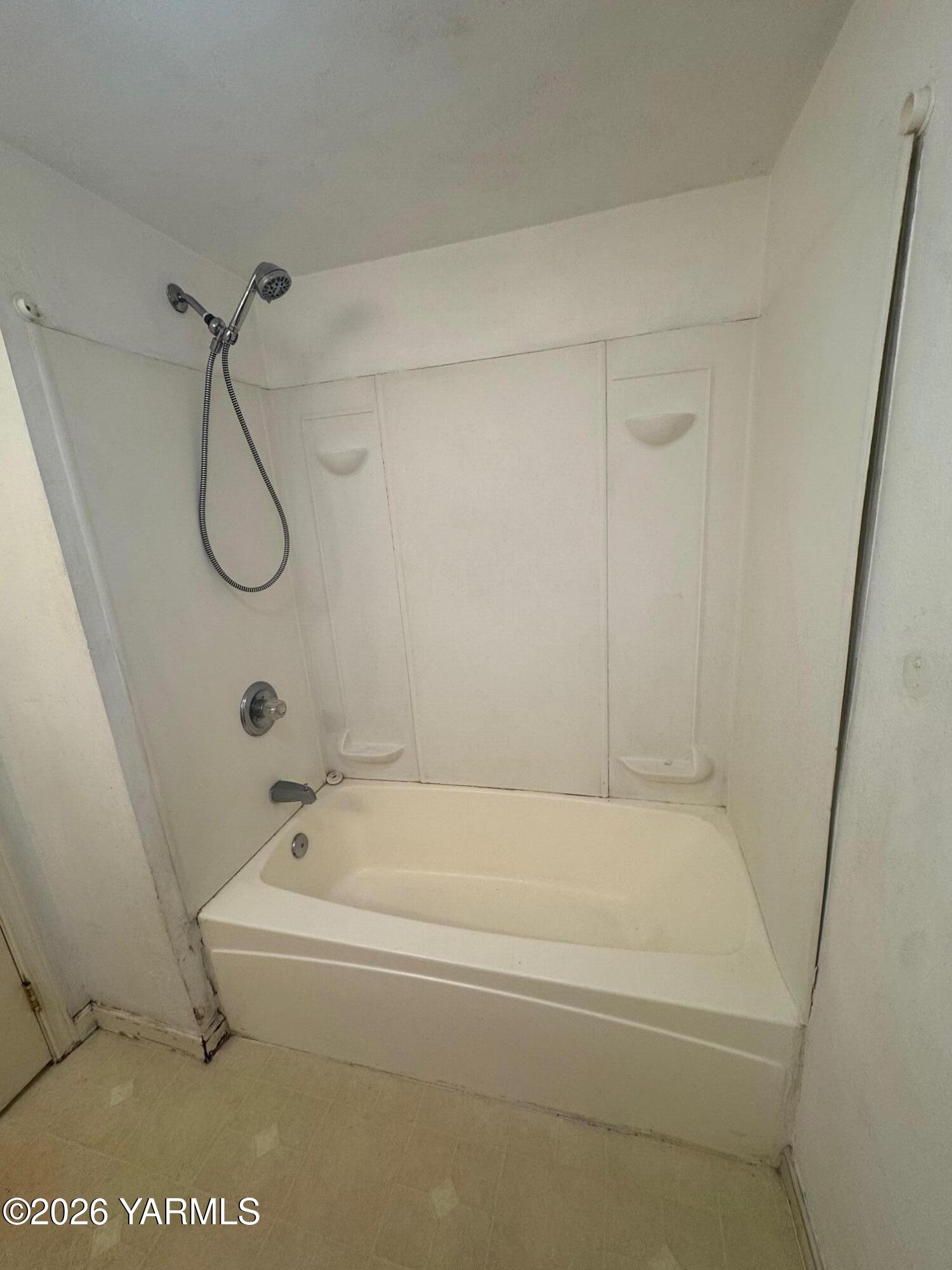 110 East Second Street Naches, WA 98937 - Photo 10 of 17 a bathroom with a bath tub with a shower