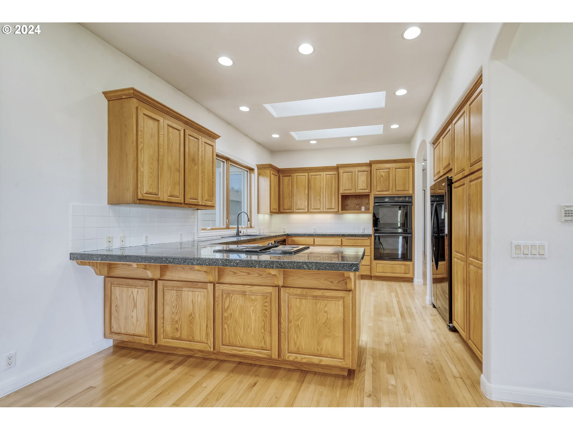 35741 Spring Hill Road Creswell, OR 97426 - Photo 13 of 47 a kitchen with stainless steel appliances granite countertop a sink and cabinets