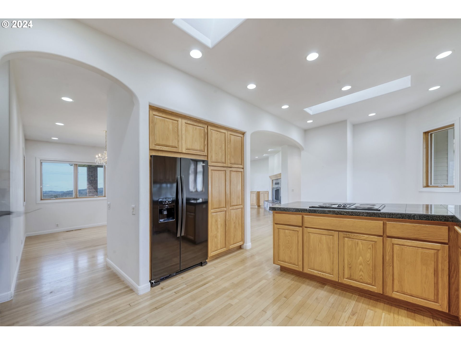35741 Spring Hill Road Creswell, OR 97426 - Photo 15 of 47 a open kitchen with stainless steel appliances granite countertop a refrigerator and a sink