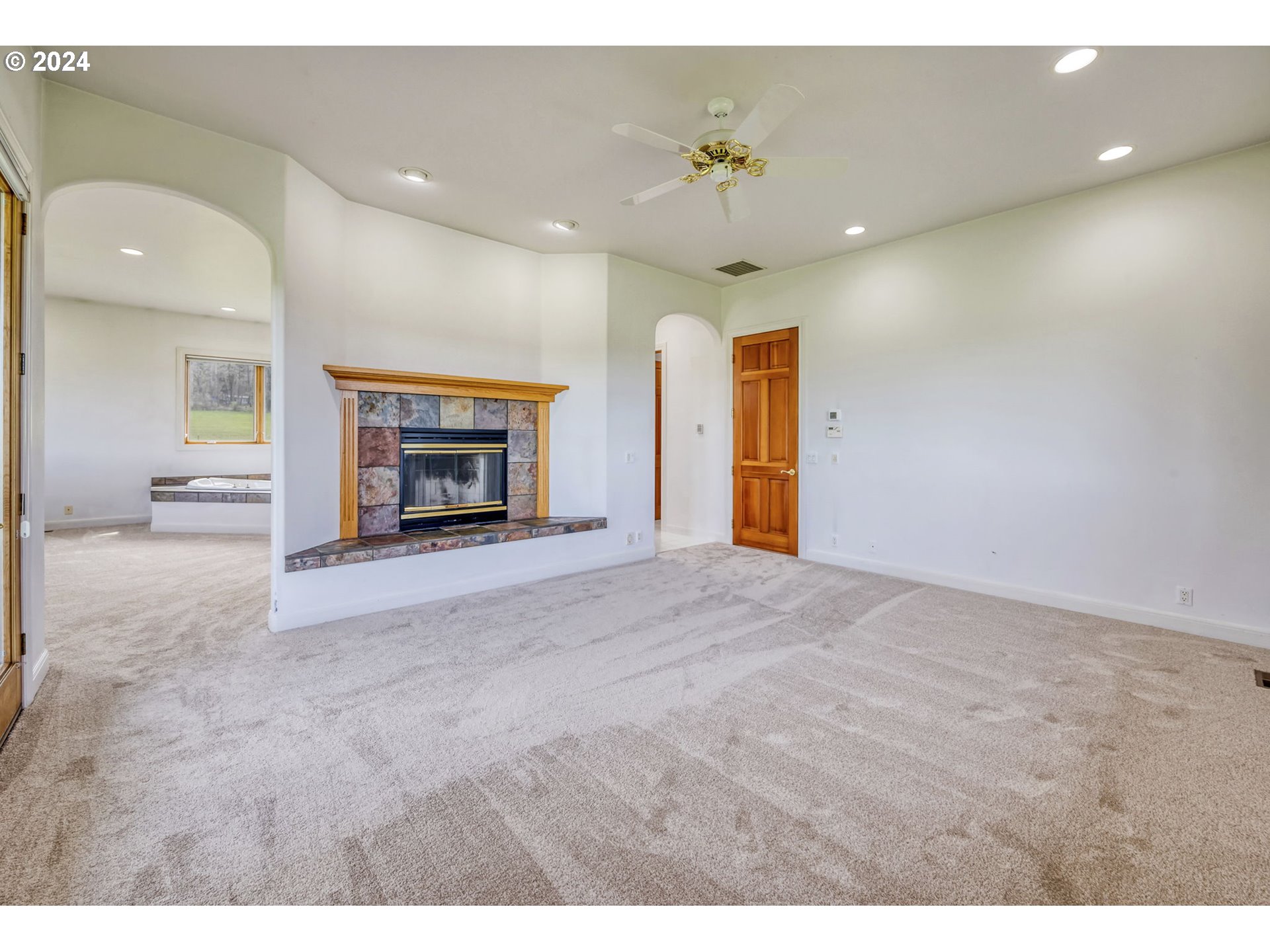 35741 Spring Hill Road Creswell, OR 97426 - Photo 23 of 47 a view of an empty room and fire place