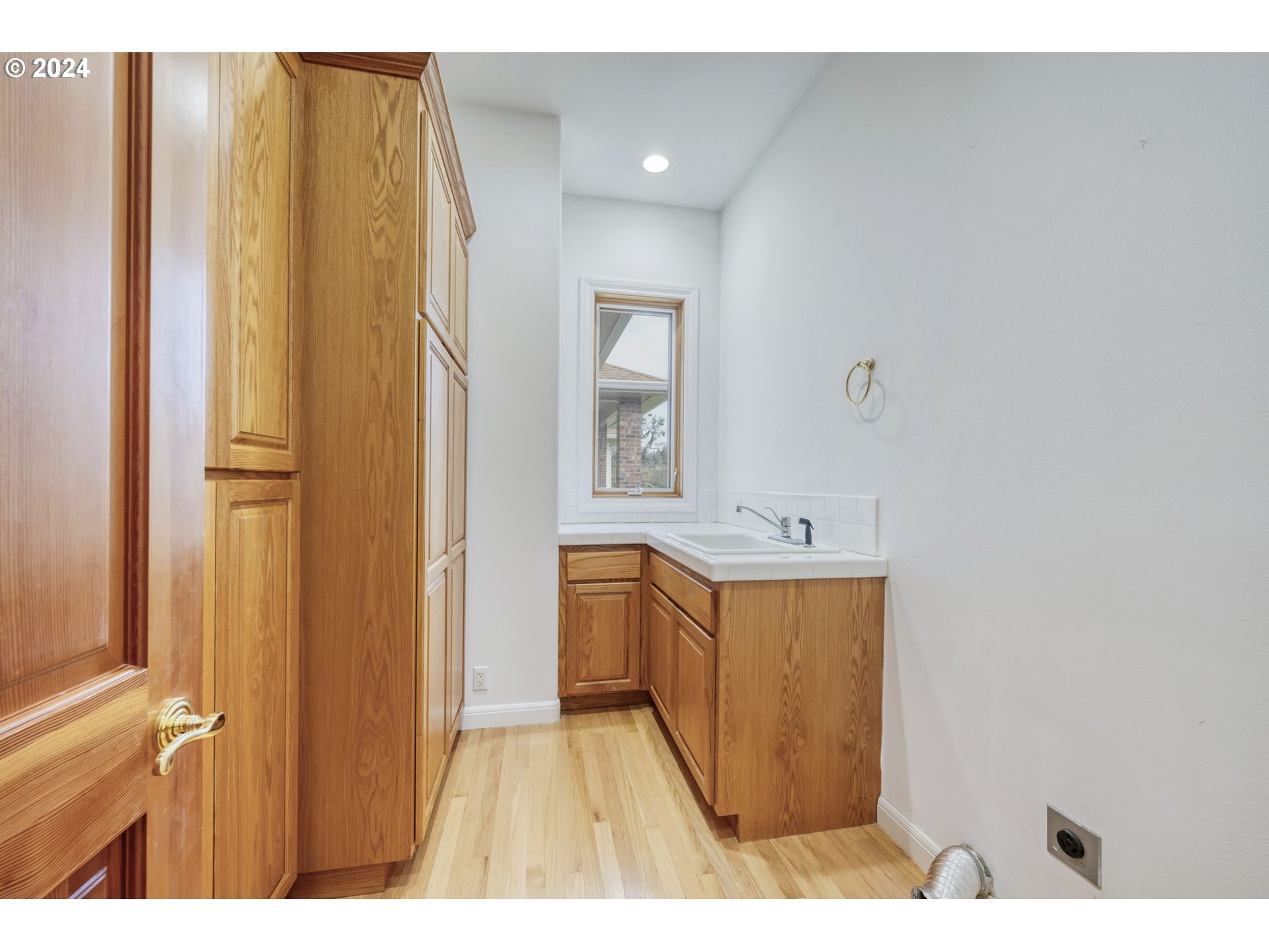 35741 Spring Hill Road Creswell, OR 97426 - Photo 39 of 47 a bathroom with a sink a mirror and wooden floor
