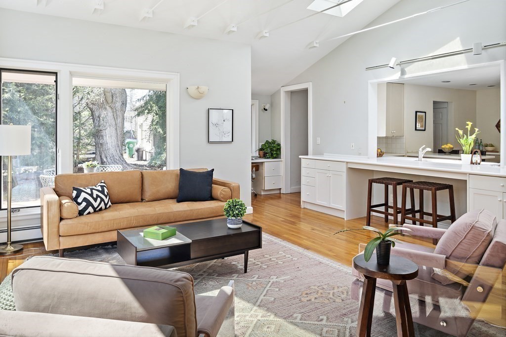 228 Islington Road Newton, MA 02466 - Photo 1 of 29 a living room with furniture a large window and a table