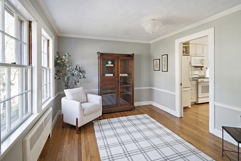 228 Islington Road Newton, MA 02466 - Photo 12 of 29 a living room with furniture and a floor to ceiling window