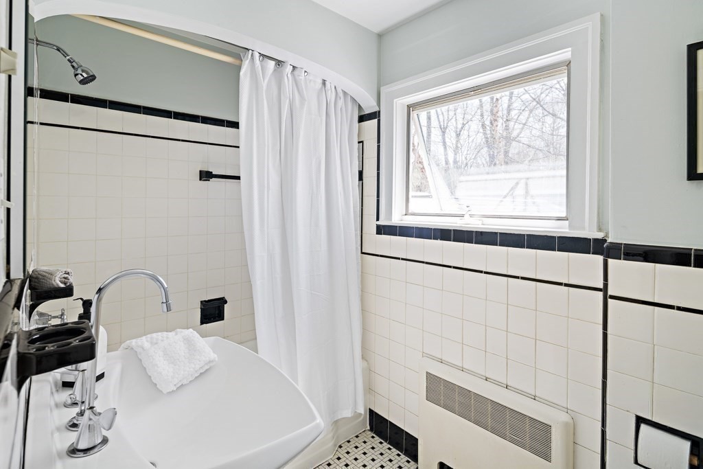 228 Islington Road Newton, MA 02466 - Photo 21 of 29 a bathroom with a bathtub and shower