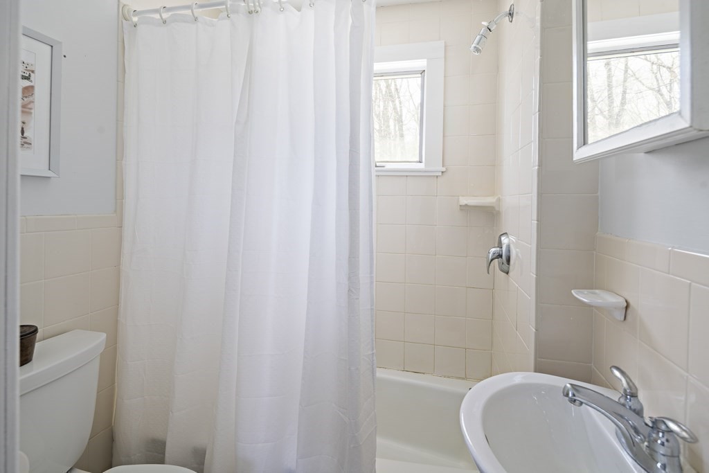 228 Islington Road Newton, MA 02466 - Photo 22 of 29 a bathroom with a sink toilet and shower