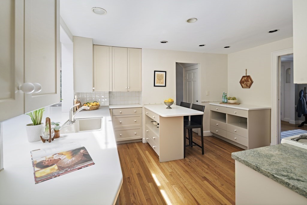 228 Islington Road Newton, MA 02466 - Photo 5 of 29 a kitchen that has a lot of cabinets a sink and appliances in it