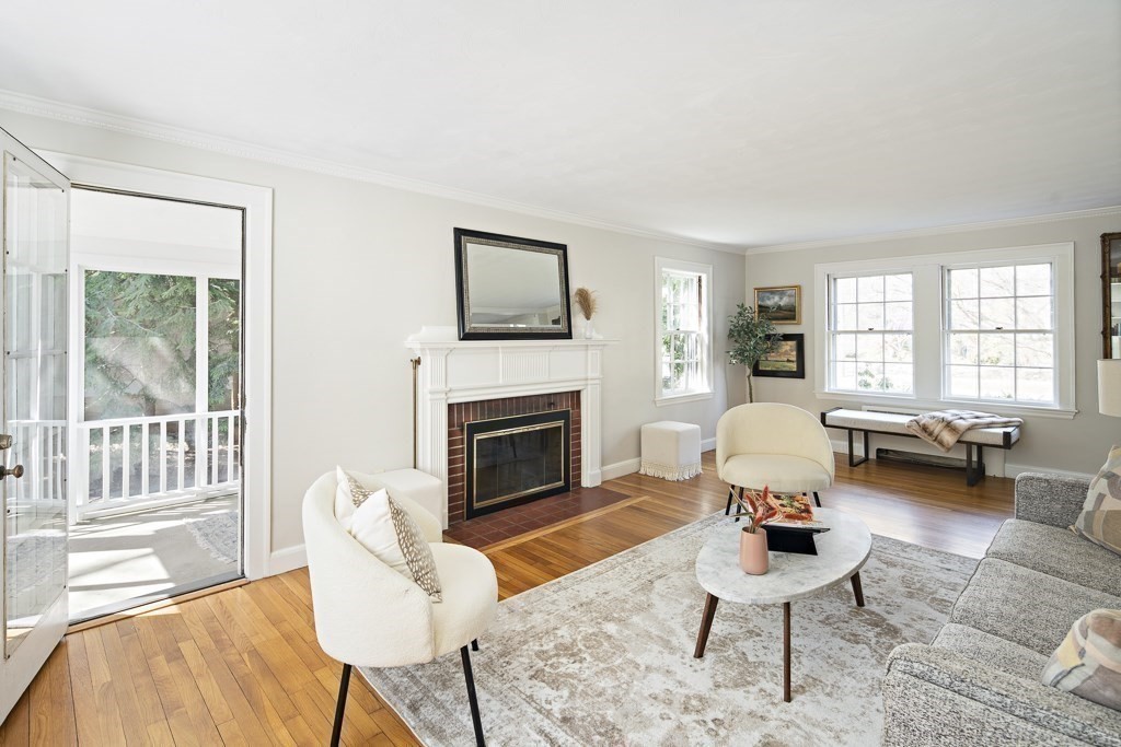 228 Islington Road Newton, MA 02466 - Photo 7 of 29 a living room with furniture a fireplace and a large window