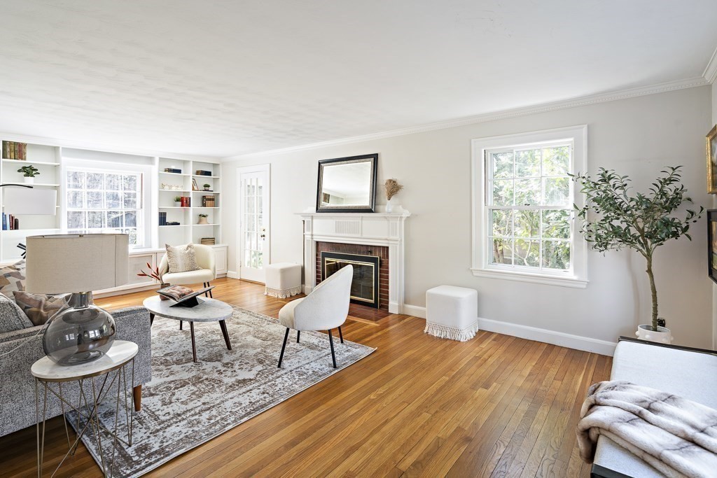 228 Islington Road Newton, MA 02466 - Photo 8 of 29 a living room with furniture and a fireplace