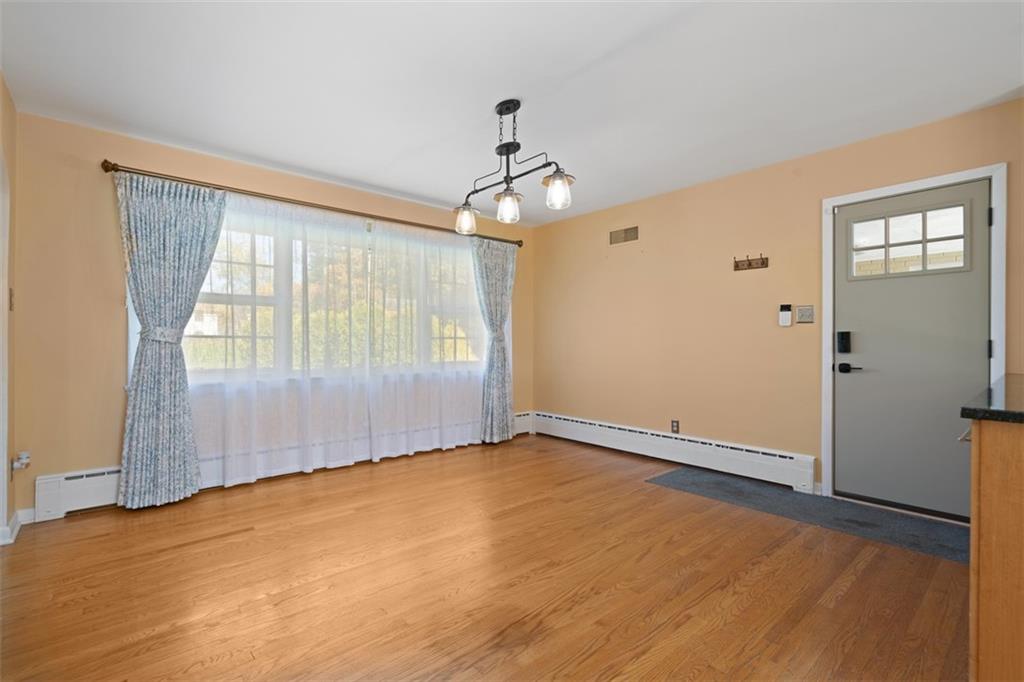 208 Summit Road Butler, PA 16001 - Photo 12 of 33 wooden floor in an empty room with a window