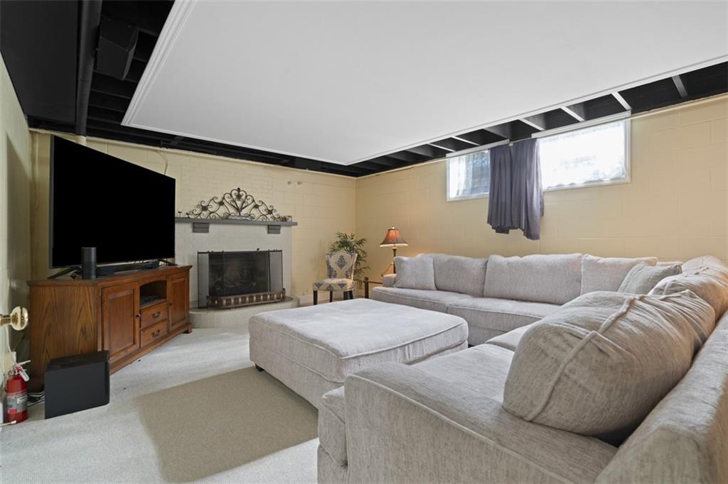 208 Summit Road Butler, PA 16001 - Photo 20 of 33 a living room with furniture and a flat screen tv