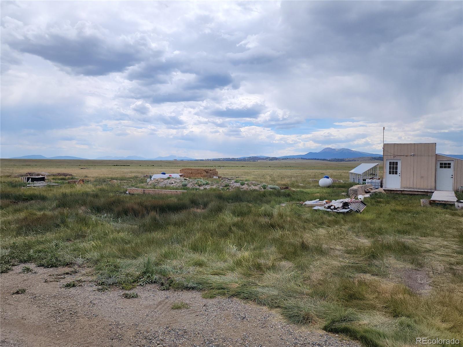 161 Fourmile Creek Road Hartsel, CO 80449 - Photo 11 of 31 a view of a lake with houses in the back