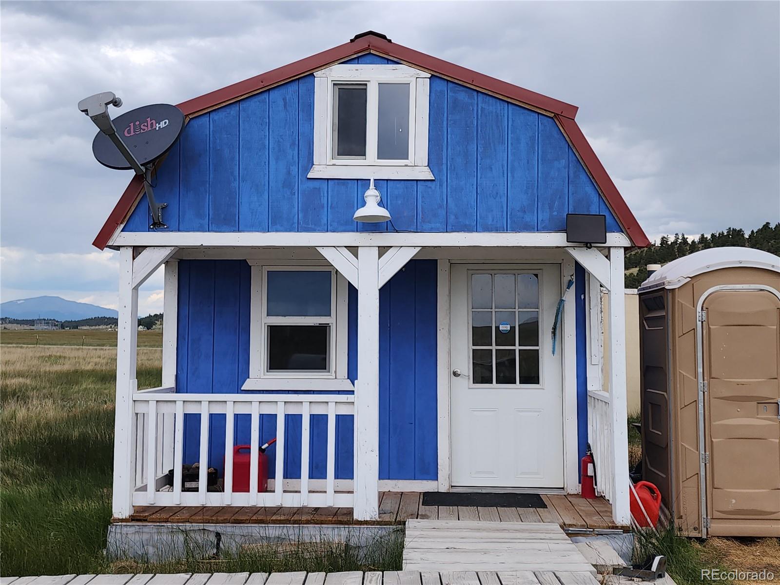 161 Fourmile Creek Road Hartsel, CO 80449 - Photo 17 of 31 a front view of a house with balcony