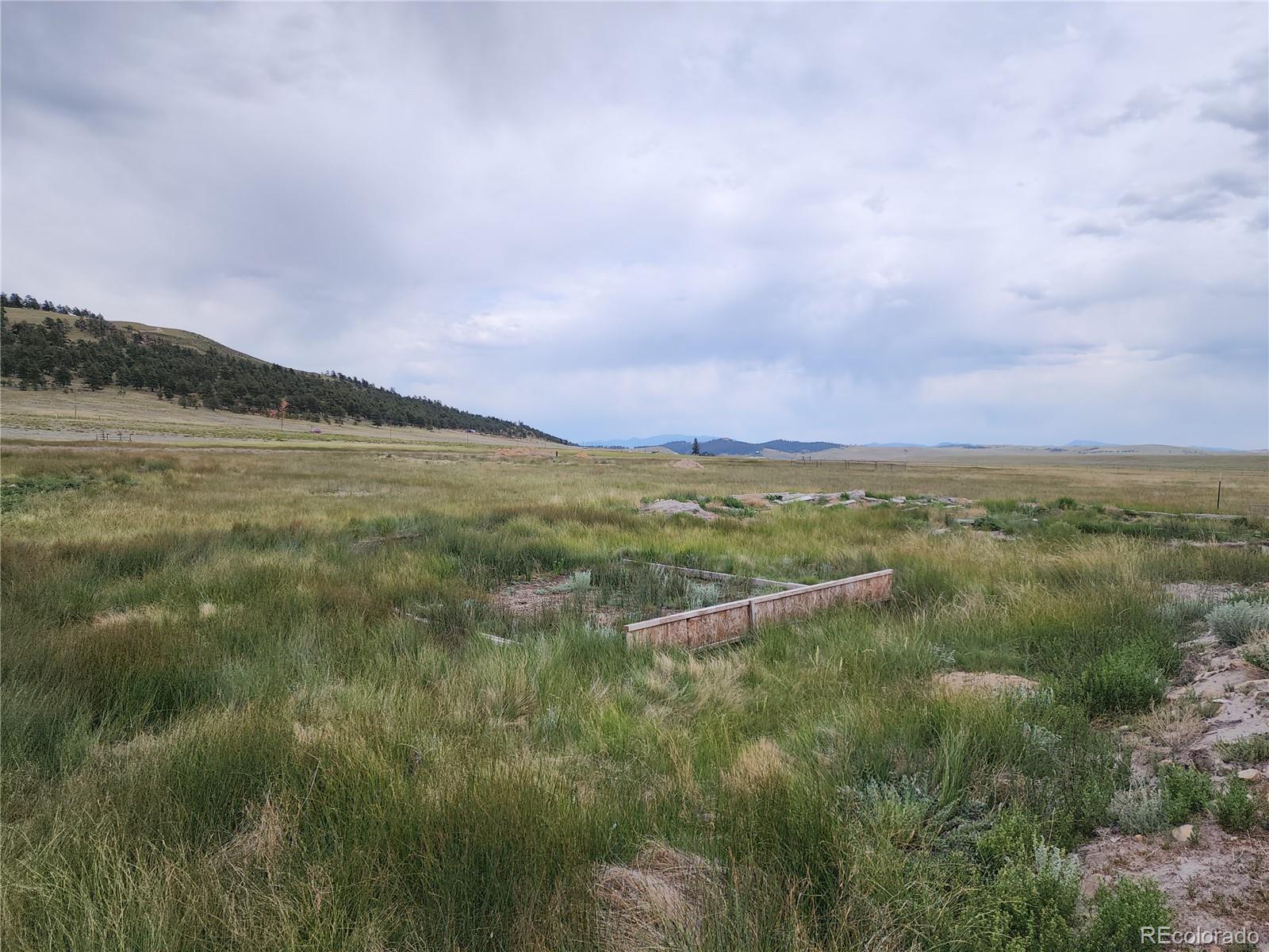 161 Fourmile Creek Road Hartsel, CO 80449 - Photo 22 of 31 a view of a lake with a mountain in the background