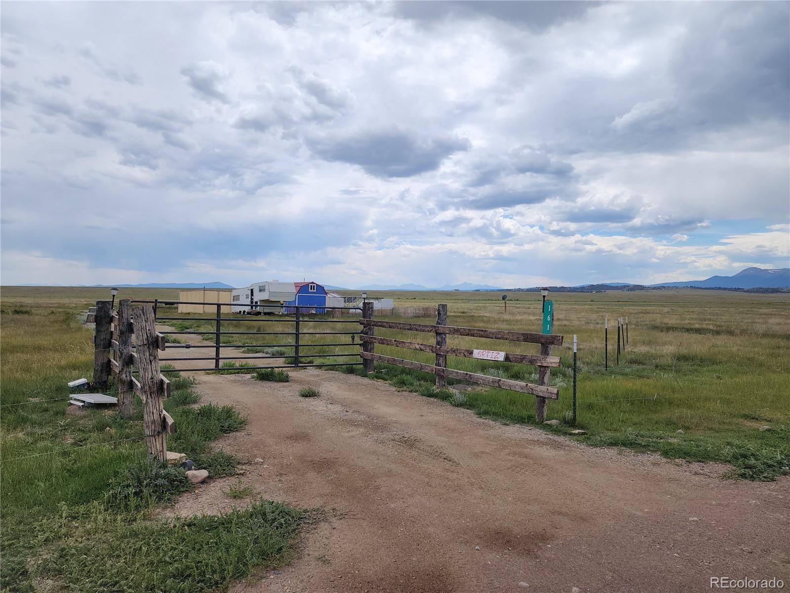 161 Fourmile Creek Road Hartsel, CO 80449 - Photo 3 of 31 an outdoor view with a garden