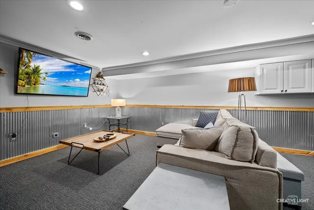 a reading room with furniture and painting on the wall