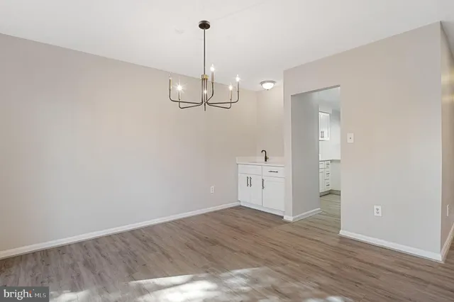 a bathroom with a sink vanity and mirror