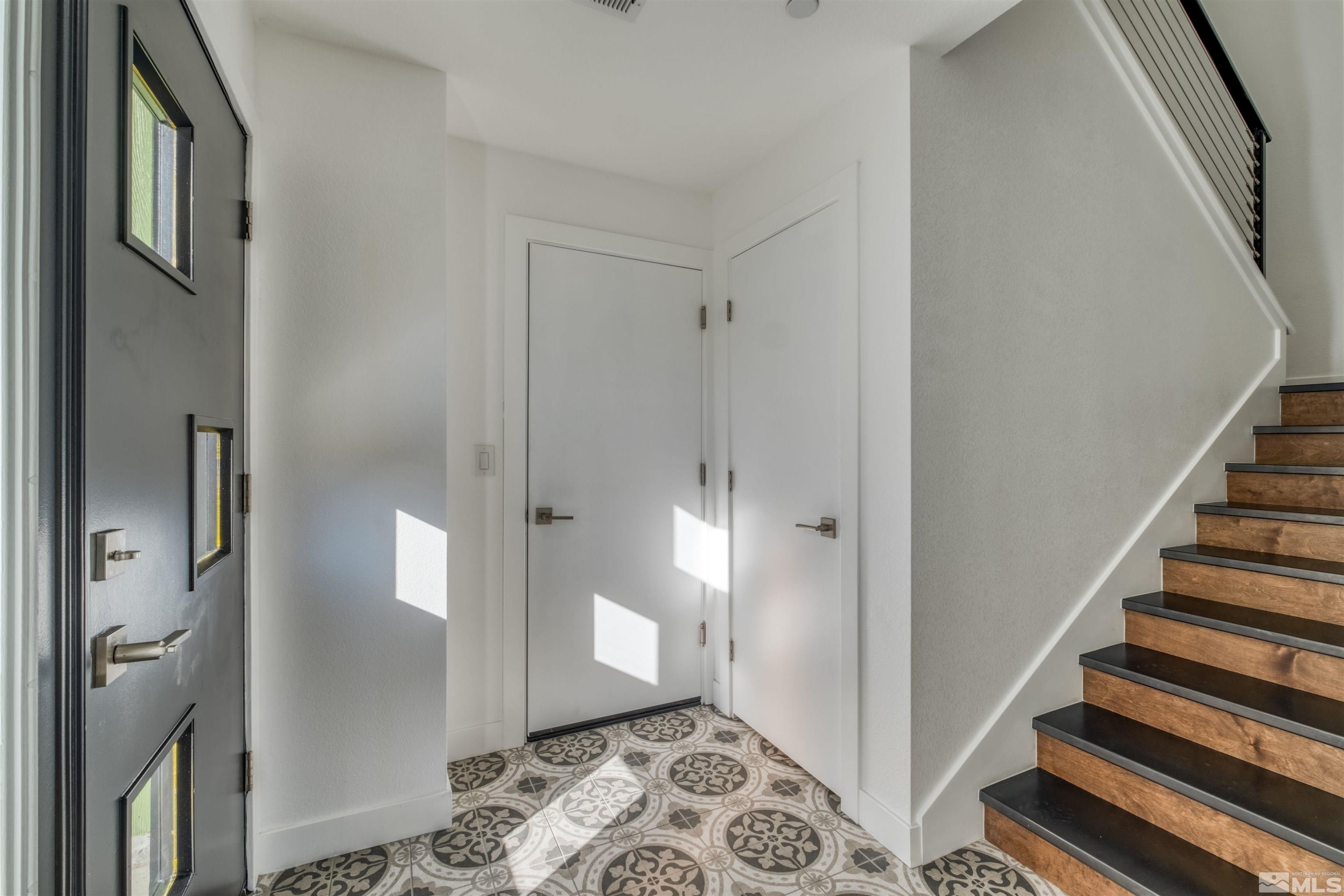 335 Roberts Street Reno, NV 89502 - Photo 7 of 18 a view of a hallway with entryway and wooden floor